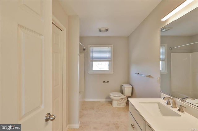 bathroom featuring visible vents, toilet, shower / washtub combination, baseboards, and vanity