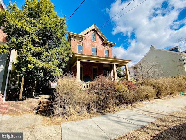 italianate home with brick siding