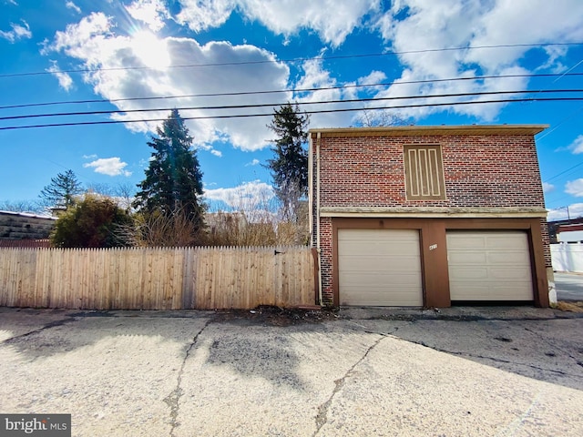 garage with fence