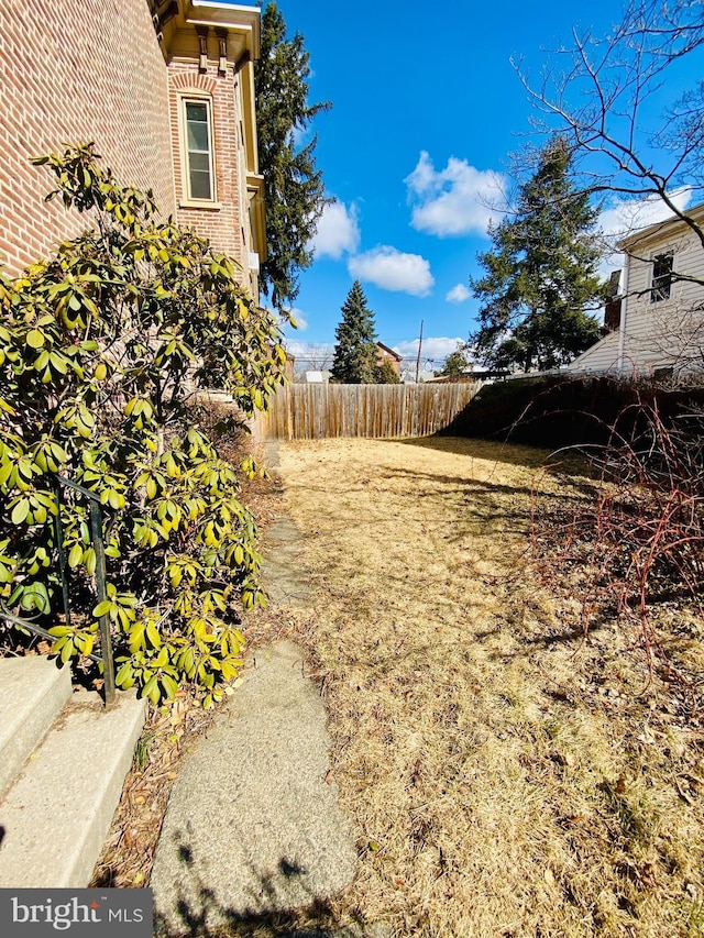 view of yard with fence