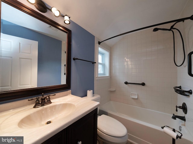 bathroom featuring visible vents, toilet, washtub / shower combination, lofted ceiling, and vanity