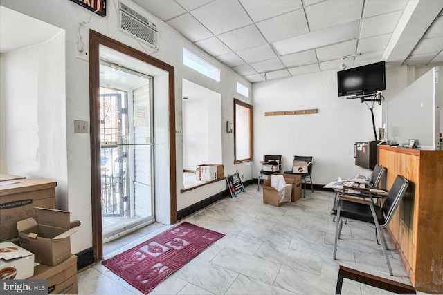 interior space with visible vents, track lighting, and a drop ceiling