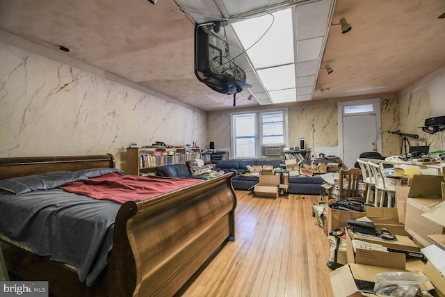 bedroom with hardwood / wood-style floors