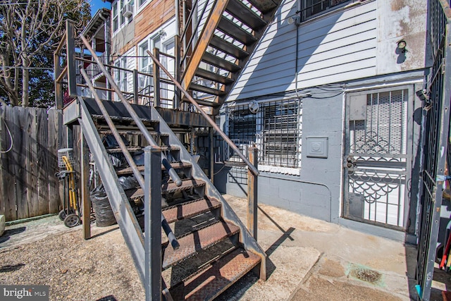 view of exterior entry with fence