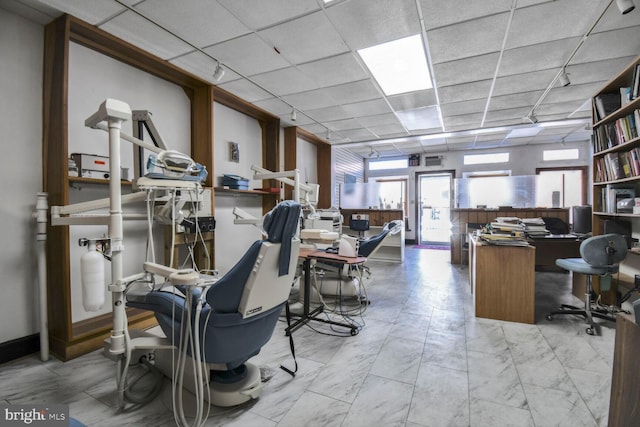 home office featuring a paneled ceiling