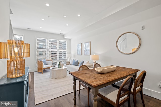 dining space featuring recessed lighting, baseboards, and wood finished floors