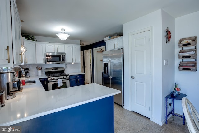 1107 Liberty Ave, Vineland, NJ 08360 - kitchen with a sink, appliances with stainless steel finishes, white cabinets, light countertops, and decorative backsplash