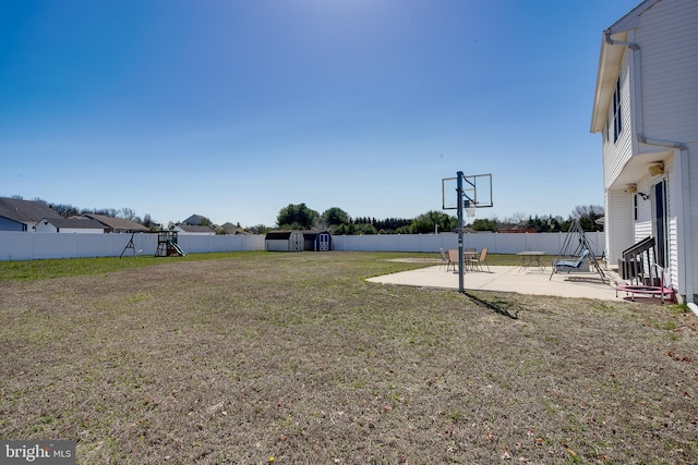 1107 Liberty Ave, Vineland, NJ 08360 - view of yard featuring an outbuilding, a fenced backyard, a playground, a shed, and a patio area