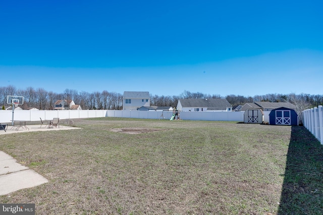 1107 Liberty Ave, Vineland, NJ 08360 - view of yard with an outbuilding, a storage shed, a patio, and a fenced backyard