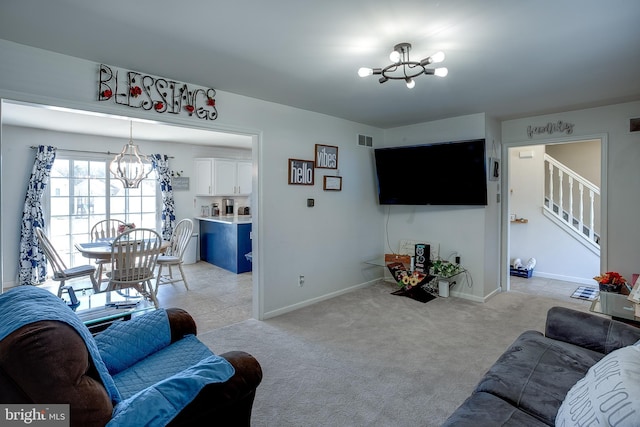 1107 Liberty Ave, Vineland, NJ 08360 - living room with visible vents, baseboards, light colored carpet, stairs, and a notable chandelier
