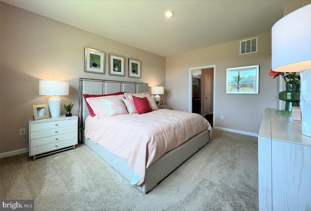 carpeted bedroom featuring visible vents and baseboards