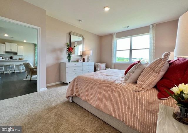 bedroom with recessed lighting, carpet flooring, baseboards, and visible vents