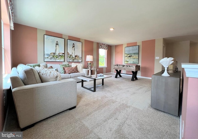 carpeted living area featuring recessed lighting and baseboards