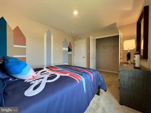 carpeted bedroom featuring visible vents and a closet