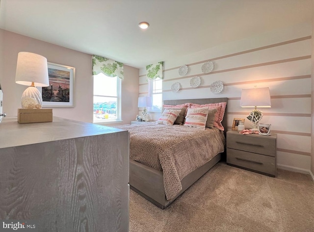 carpeted bedroom featuring baseboards