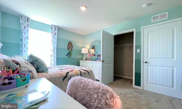 bedroom featuring visible vents, a closet, and carpet flooring