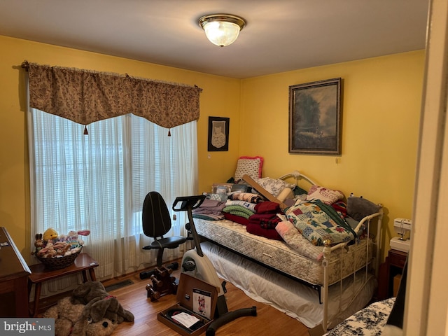 bedroom featuring wood finished floors