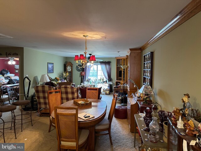 dining space with carpet floors and a chandelier