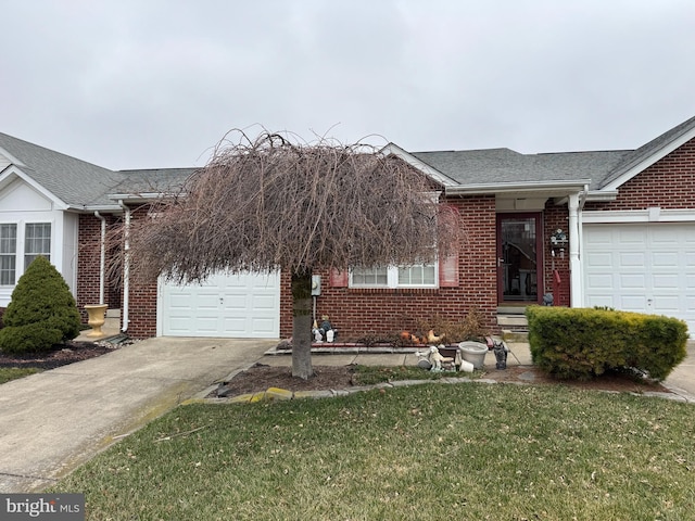 view of front facade with brick siding, a shingled roof, concrete driveway, a front yard, and a garage