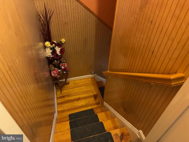 staircase with wood finished floors