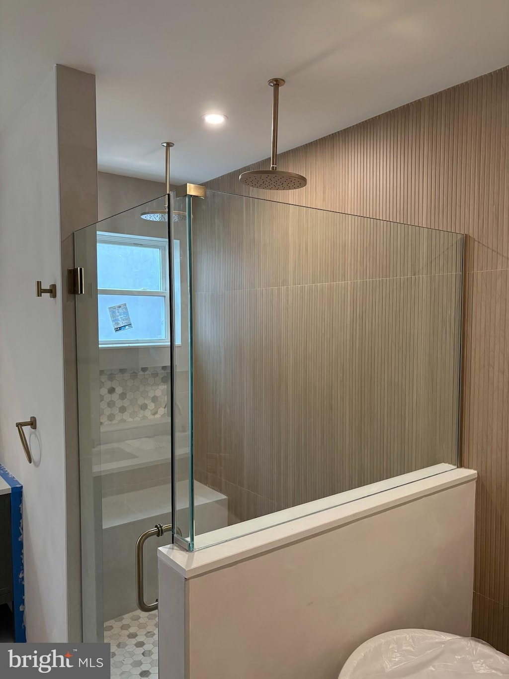 bathroom with recessed lighting and a stall shower