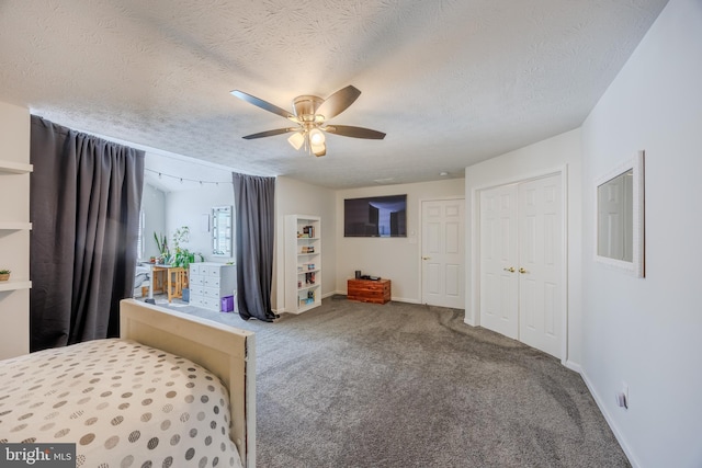 bedroom with baseboards, a textured ceiling, ceiling fan, and carpet flooring