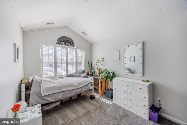 bedroom with lofted ceiling, visible vents, and carpet floors