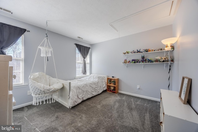 bedroom featuring visible vents, carpet flooring, attic access, and baseboards