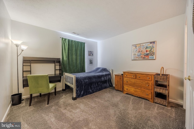 carpeted bedroom with baseboards and visible vents