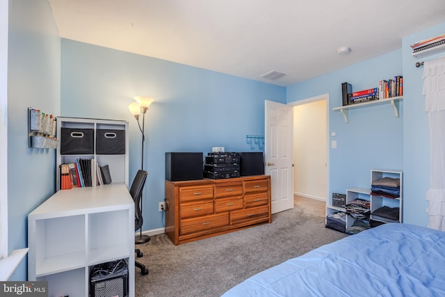 carpeted bedroom featuring baseboards and visible vents