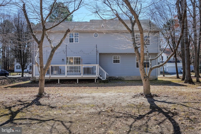 back of property with a deck