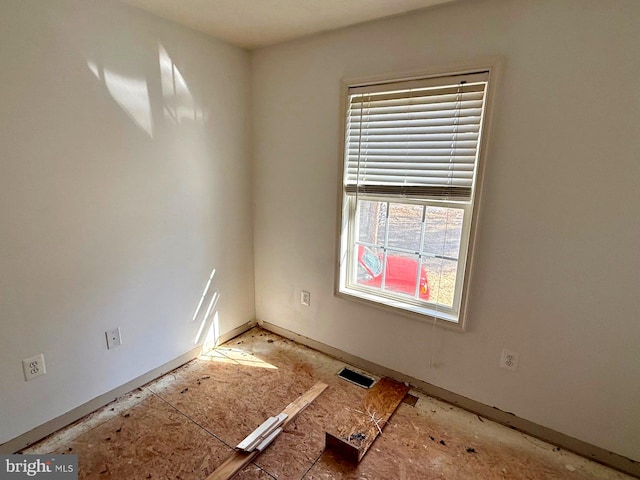 spare room featuring visible vents