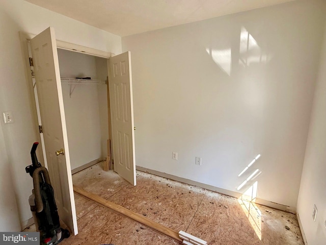 unfurnished bedroom with a closet
