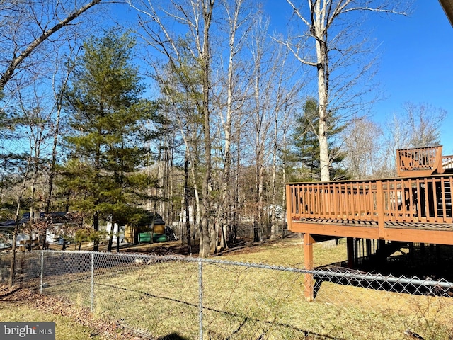 view of yard featuring a deck and fence