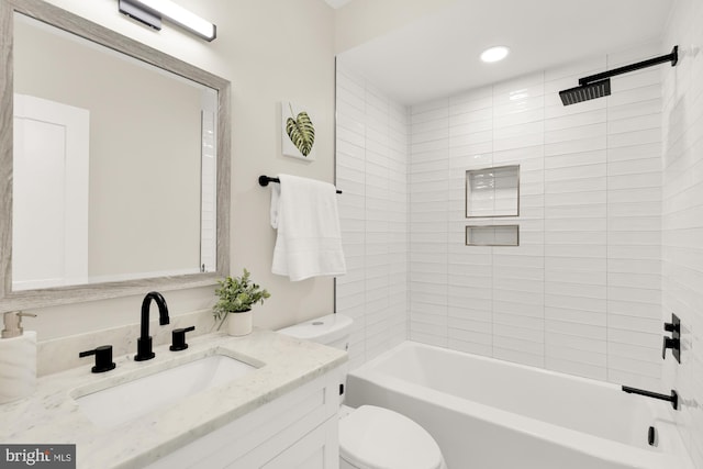 full bath featuring shower / bathing tub combination, toilet, and vanity