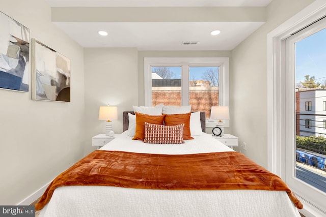 bedroom featuring recessed lighting, visible vents, baseboards, and access to exterior