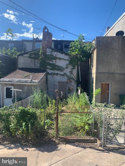 view of side of home with fence