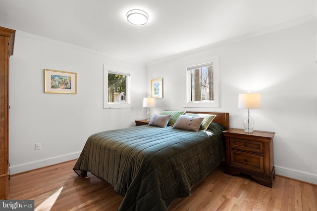 bedroom featuring light wood-style floors and ornamental molding