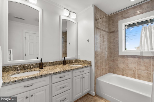 full bath with crown molding, double vanity, visible vents, and a sink