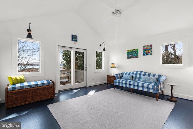 sitting room featuring baseboards, high vaulted ceiling, and dark wood-style flooring