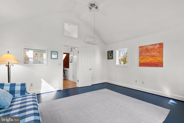 living area with a wall unit AC, baseboards, a wealth of natural light, and dark wood-type flooring