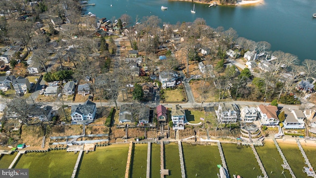 bird's eye view with a residential view and a water view