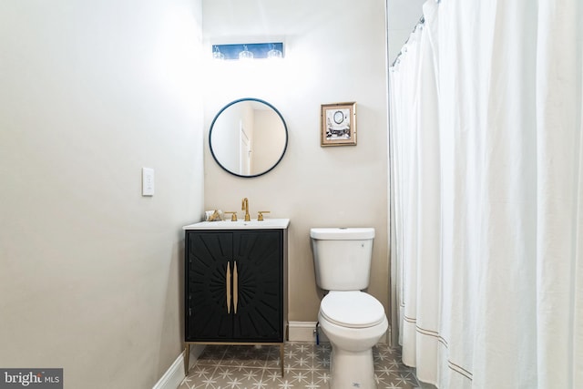 full bath featuring baseboards, toilet, and vanity