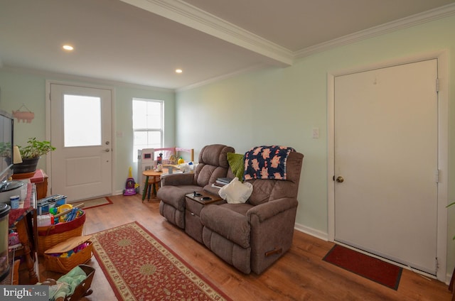 living area with recessed lighting, ornamental molding, and wood finished floors