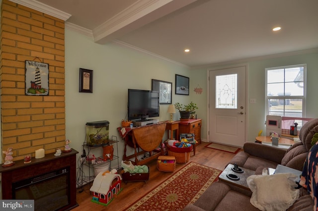 living room featuring recessed lighting, crown molding, and wood finished floors