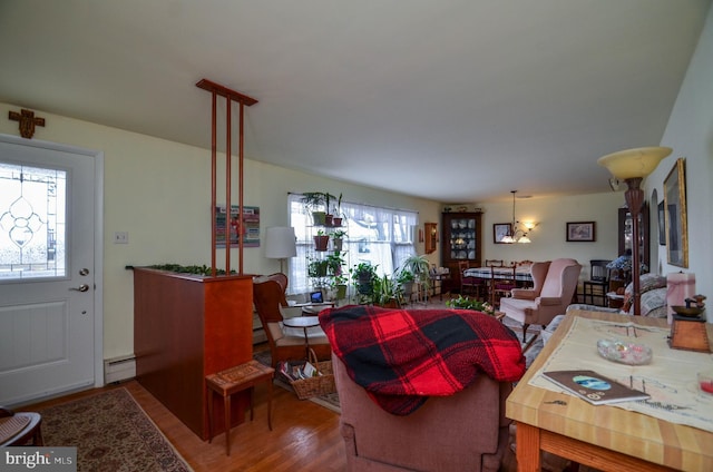 living room featuring a baseboard radiator and wood finished floors