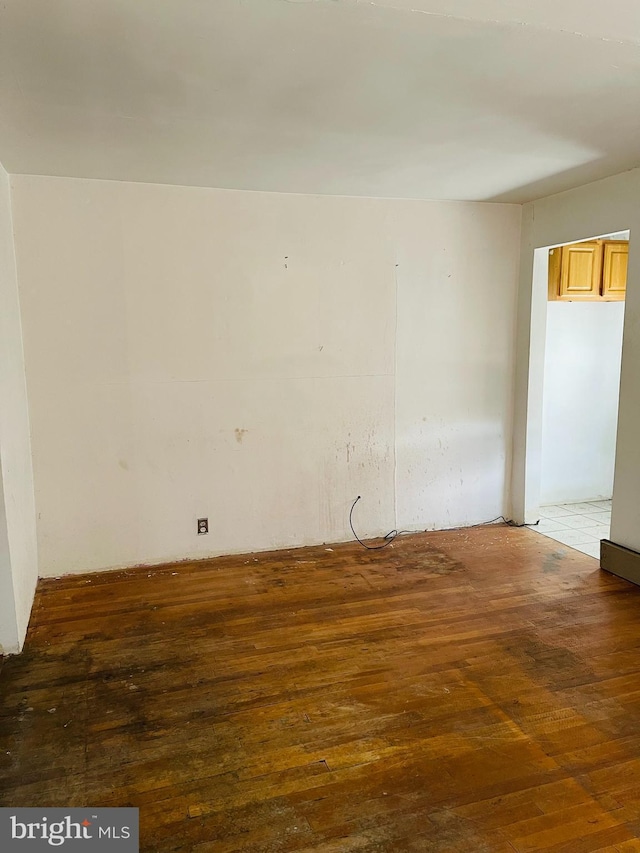 empty room featuring hardwood / wood-style flooring