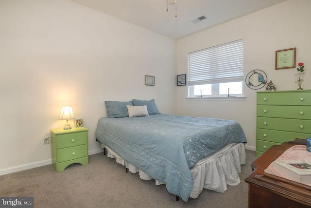 bedroom with carpet flooring, baseboards, and visible vents