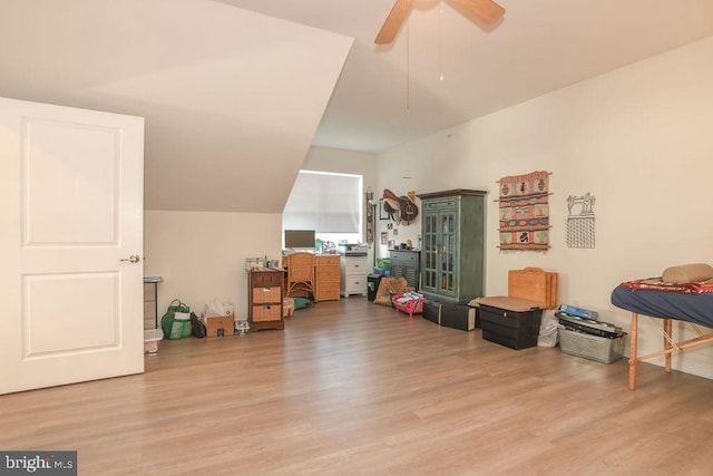 playroom featuring a ceiling fan, lofted ceiling, and wood finished floors