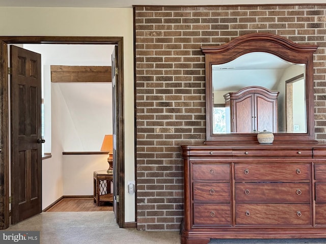 interior details featuring baseboards and carpet floors